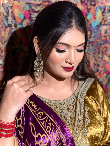 Another angle of the minimal glam look, showing how the makeup complements the rich velvet outfit.