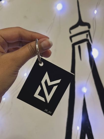 A simple and sleek mini booklet keychain, perfect for carrying a small collection of photos or illustrations.