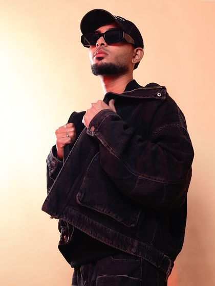 Keeping it real. Whether in the studio or in a photoshoot, the attitude is the same. It's about being confident in your work and your vision.