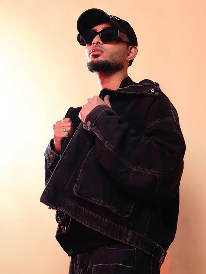 A stylish portrait showcasing my profile and outfit. As an artist, my visual presentation is as curated as my music.
