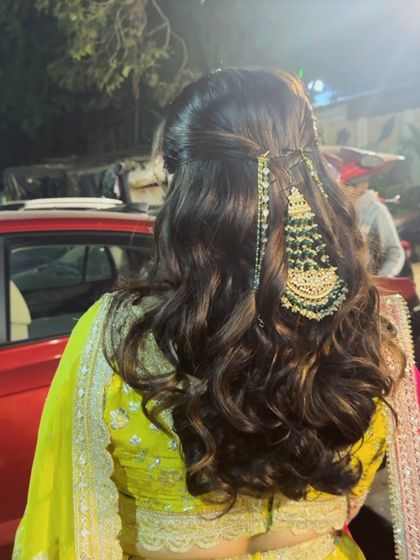 The full hairstyle from the back, showing how a passa can be used to adorn a simple half-up, half-down look.