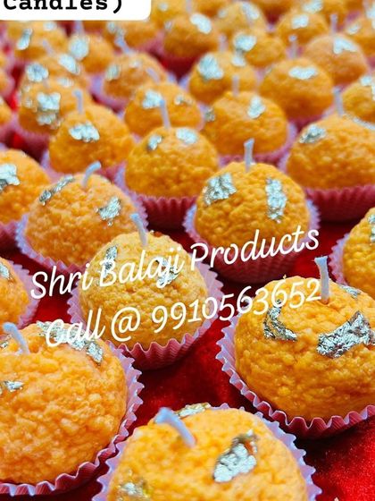 A close-up of my perfumed soy wax Motichoor Ladoo candles, decorated with silver foil. They look incredibly festive and are perfect for celebrations like Diwali.