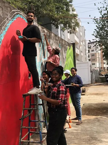 Here are some moments from the creation of the 'Stories of Water' mural. It started with awkward introductions and ended with a community of strangers and friends painting together, sharing stories, and bringing color and conversation to a public space.