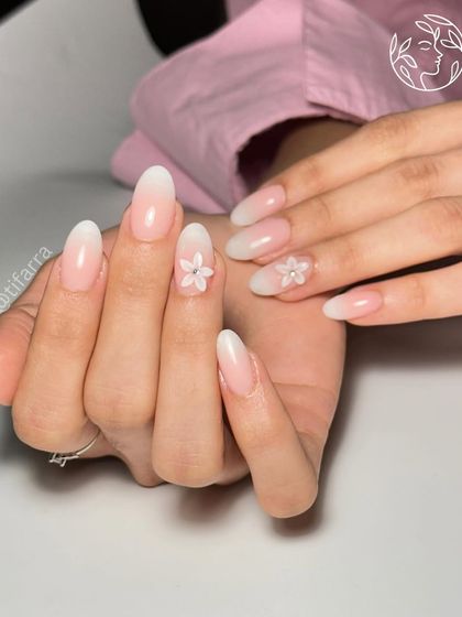 Nails that bloom with beauty. A lovely set of ombre nails with delicate 3D flower accents for a touch of subtle elegance.