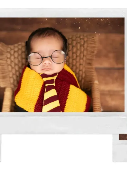 A close-up of our little Harry Potter, sleeping peacefully with his iconic round glasses. We have all the props to make this magical theme come to life.