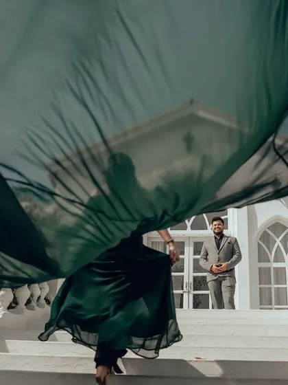 Capturing the beautiful chaos of a windswept dress against a classic white facade. I use dynamic movement and composition to create artistic, high-fashion images that are full of life and energy.