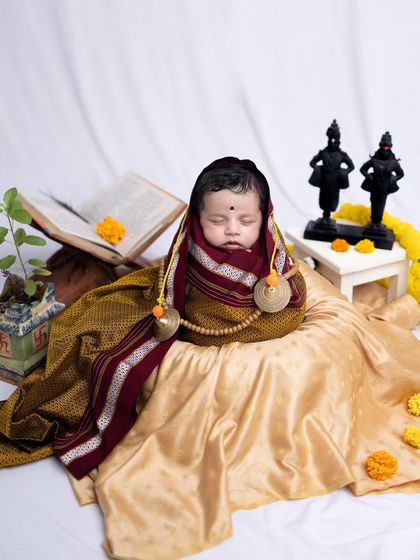 A full view of the colorful 'Vitthal Rakhumai' setup, complete with marigold flowers, a Tulsi plant, and idols, creating a vibrant and sacred scene.