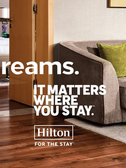 A shot from the Hilton campaign focusing on the luxurious suite environment. The text "suite dreams" sets the mood for relaxation and comfort that my styling work aims to reflect.