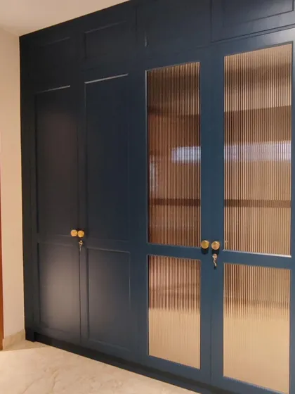 Details matter in high-end interiors. This custom-built storage unit, finished in a deep blue with fluted glass and brass hardware, shows my commitment to craftsmanship and creating bespoke pieces for executive offices and commercial spaces.