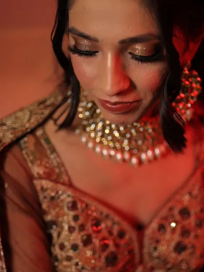 A soft and romantic makeup look for an engagement ceremony. The focus is on glittery eyes and glowing skin, creating a dreamy and elegant look for the bride-to-be.