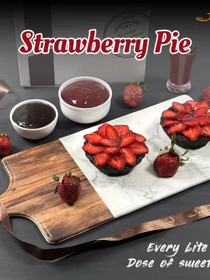 Our Strawberry Pie is a dose of sweetness in every bite. We create a beautiful floral pattern with fresh strawberry slices on top of a rich chocolate tart base, making it as beautiful as it is delicious.