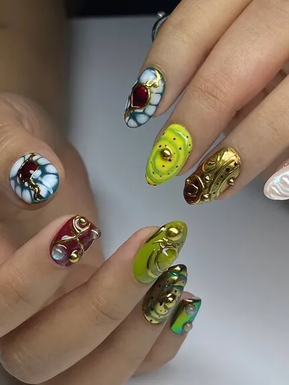 A true work of art on every nail. This set features a vibrant mix of colors and textures, with 3D sculpted elements, gold details, and jewel-like accents, showcasing our most creative and high-fashion designs.