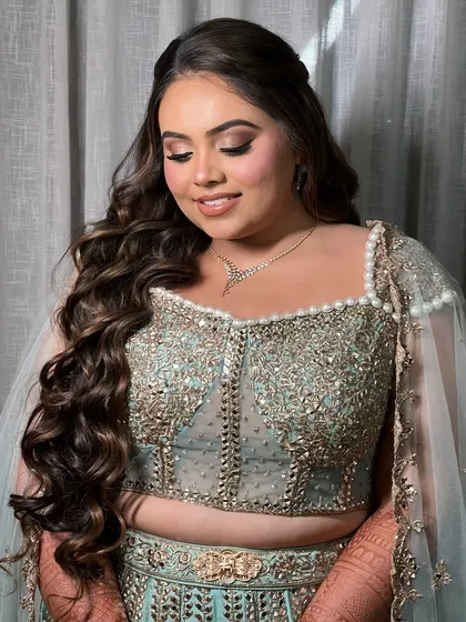 A soft and serene shot. The gentle waves and side parting create a look of effortless elegance.