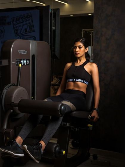 The leg extension machine is perfect for isolating and strengthening the quadriceps. We incorporate targeted machine work like this to build well-rounded muscle definition.