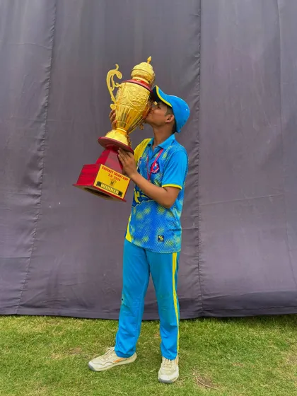A kiss for the trophy. The love for the game and the victory.