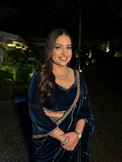 A goddess in midnight blue. For this evening look, I created a bronze smokey eye and glowing skin that perfectly complemented her velvet saree.
