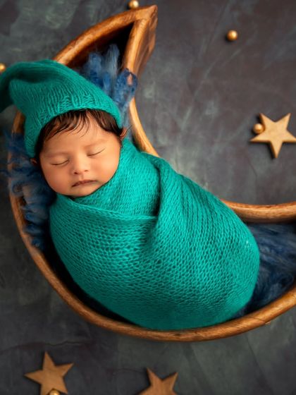 A variation of the moon theme, this time with a cute, long pixie hat that adds a touch of whimsy and character to the portrait.