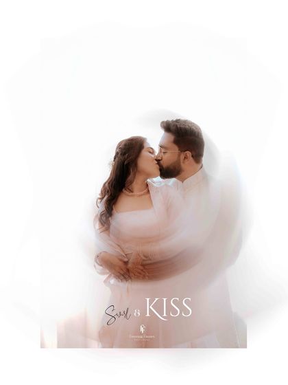 An artistic and dreamy shot of an engagement kiss, created with a slow shutter speed for a beautiful swirl effect. This technique adds a touch of magic to the moment.