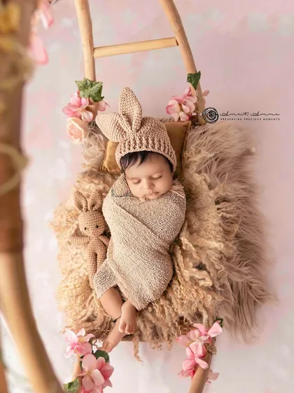 A beautiful composition using the ladder and floral accents. This pose is safe, comfortable for the baby, and results in a stunning, artistic image.