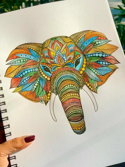 A close-up of a personal piece, an elephant mandala filled with vibrant colors. Beyond workshops and murals, I sometimes create just for myself, pouring my heart into detailed patterns like this.