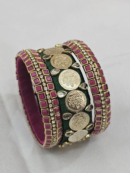 Different angles showcasing the craftsmanship of the green and ruby silk thread bridal bangle set with antique coin details.