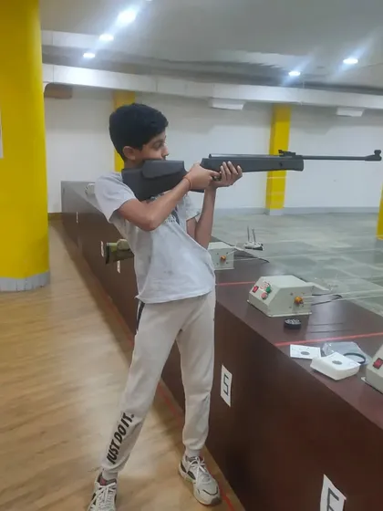 This young student demonstrates the standing shooting position he learned in our basic course. We focus on building a strong foundation for all our learners.