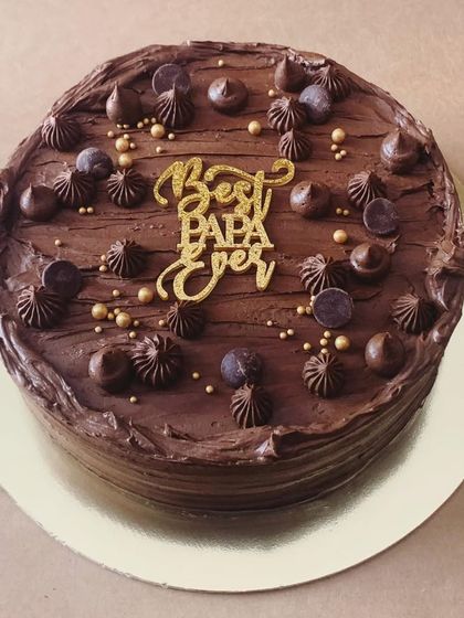 My "Best Papa Ever" cake for Father's Day. This is my ultimate chocolate cake, decorated with piped chocolate frosting, chocolate chips, and gold sprinkles.