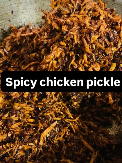 A fresh batch of my spicy shredded chicken pickle is available. It's a versatile condiment that adds a fiery kick to any dish.