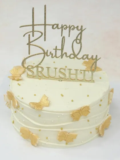 Another view of the elegant white and gold butterfly cake.