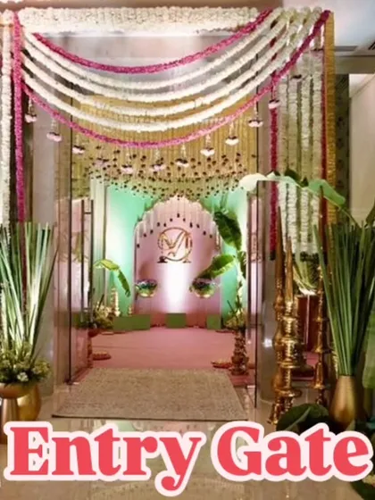 This elegant entry gate combines traditional and modern elements. I used heavy garlands of white and pink flowers, banana leaf signage, and a personalized monogram to create a welcoming and stylish entrance.