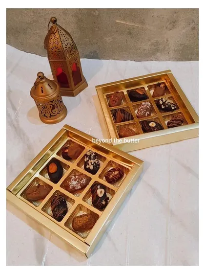 My chocolate-stuffed dates are a huge hit, especially during Ramadan and Eid. I use premium dates and fill them with delicious options like hazelnut or Biscoff, then top them with nuts and chocolate drizzles. They are presented in this elegant gold box, making them a perfect gift for the season.