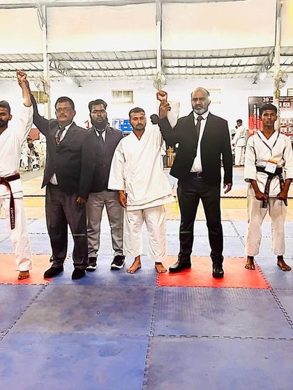 A moment of victory for our team during the team kumite event. Standing with my fellow competitors and officials, united by our shared passion for karate.