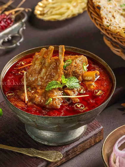 For The Mughal House, I created this dark and moody shot of Mutton Rogan Josh. The deep red curry, tender meat, and fresh garnishes are highlighted with dramatic lighting to create a rich, premium feel for their fine-dining menu.