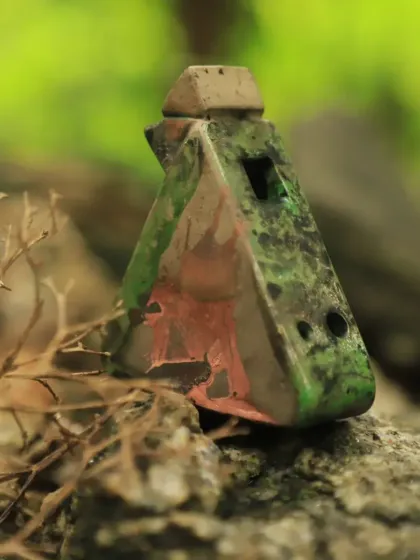 Another stunning creation from our Raku workshop. This small, house-shaped ocarina displays a beautiful patina of greens and blacks, a unique result of the firing process.