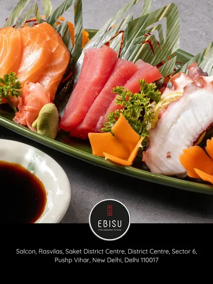 A vibrant platter of our finest sashimi, featuring fresh salmon, tuna, and octopus. We source our fish directly from Japan to ensure every slice is a perfect, melt-in-your-mouth experience.