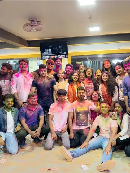 Another group shot from our unforgettable Holi party. The smiles say it all.