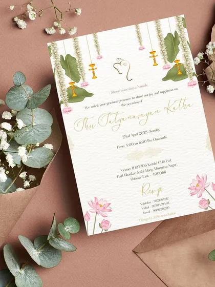 A stunning invitation for a Shri Satyanarayan Katha. The design uses a clean white texture background, beautifully adorned with traditional elements like lotuses, banana leaves, and hanging lamps.