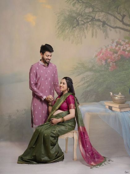 Seated against a painterly backdrop, this portrait has the feel of a classic work of art. It’s a beautiful way to capture a traditional maternity look with a touch of timeless elegance in the studio.
