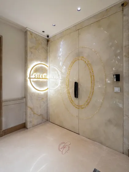 The entrance sets the tone for the entire home. This bespoke main door, crafted from luminous Selenite stone with mother of pearl inlays and a smart locking system, makes a powerful statement of refined luxury from the very first step.