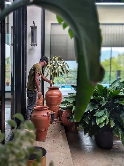 A work-in-progress shot from our gorgeous site in Wayanad. Here, we used a whole lot of large, handmade terracotta pots to embrace slow living, natural textures, and timeless design.