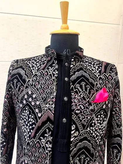 The same black velvet embroidered jacket, seen from the front. This piece is a work of art, perfect for a groom or a close family member.