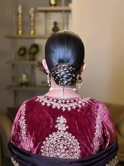 Another look at the Gotta Bun, showing the shine on the hair and the intricate weaving of the golden lace.