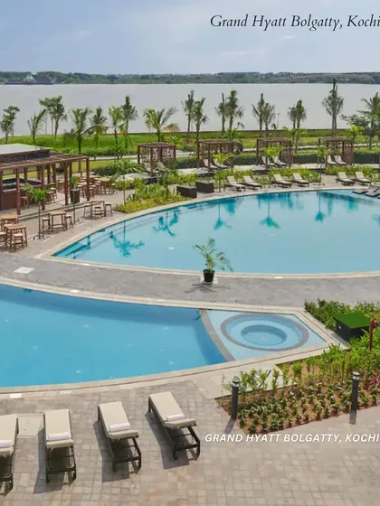 The expansive poolside at Grand Hyatt Bolgatty, Kochi. This venue offers a serene, tropical resort feel with beautiful water views.