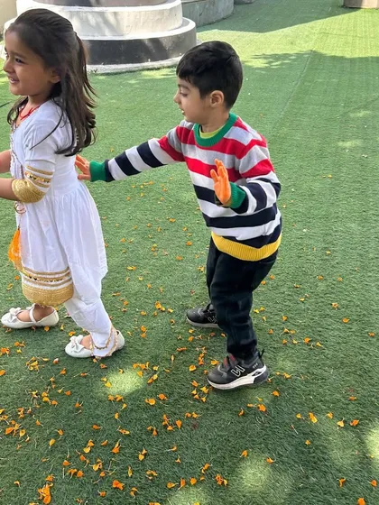 A playful moment during our Holi celebration. We use safe, skin-friendly colors so the children can enjoy the festival without any worries.