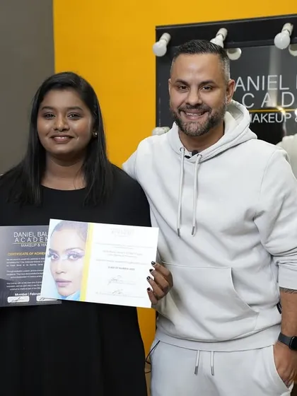 Another graduate celebrates her achievement on certification day. She is now officially part of the Daniel Bauer artist community.