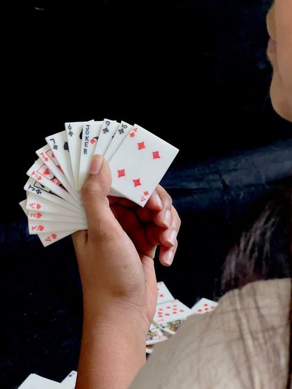 Holding a winning hand, made of porcelain. These cards feel so special and substantial in your hand.