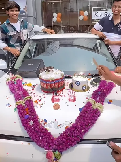 A fun celebration for a new car, complete with a KitKat pull-up cake and an evil eye cake for good luck.