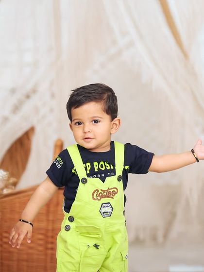 Even in an outdoor setting, I can create a stylish, boho-inspired scene. This toddler looks right at home in this curated setup surrounded by nature.