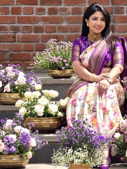 Our client Rachna radiates charm in this unique silk saree with floral prints and a contrasting Ikkath blouse.
