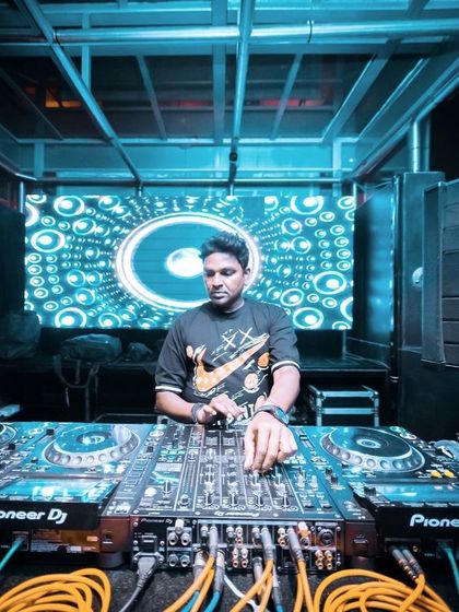 A duplicate wide shot of my DJ setup at a club.